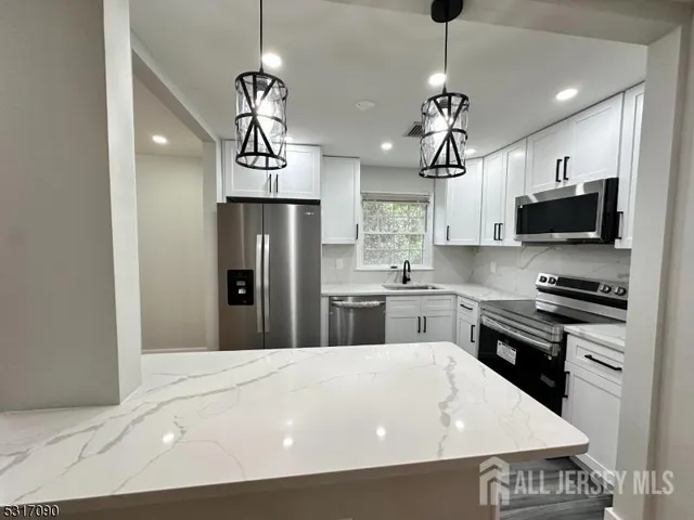 a front view of a house with a yard table and chairs