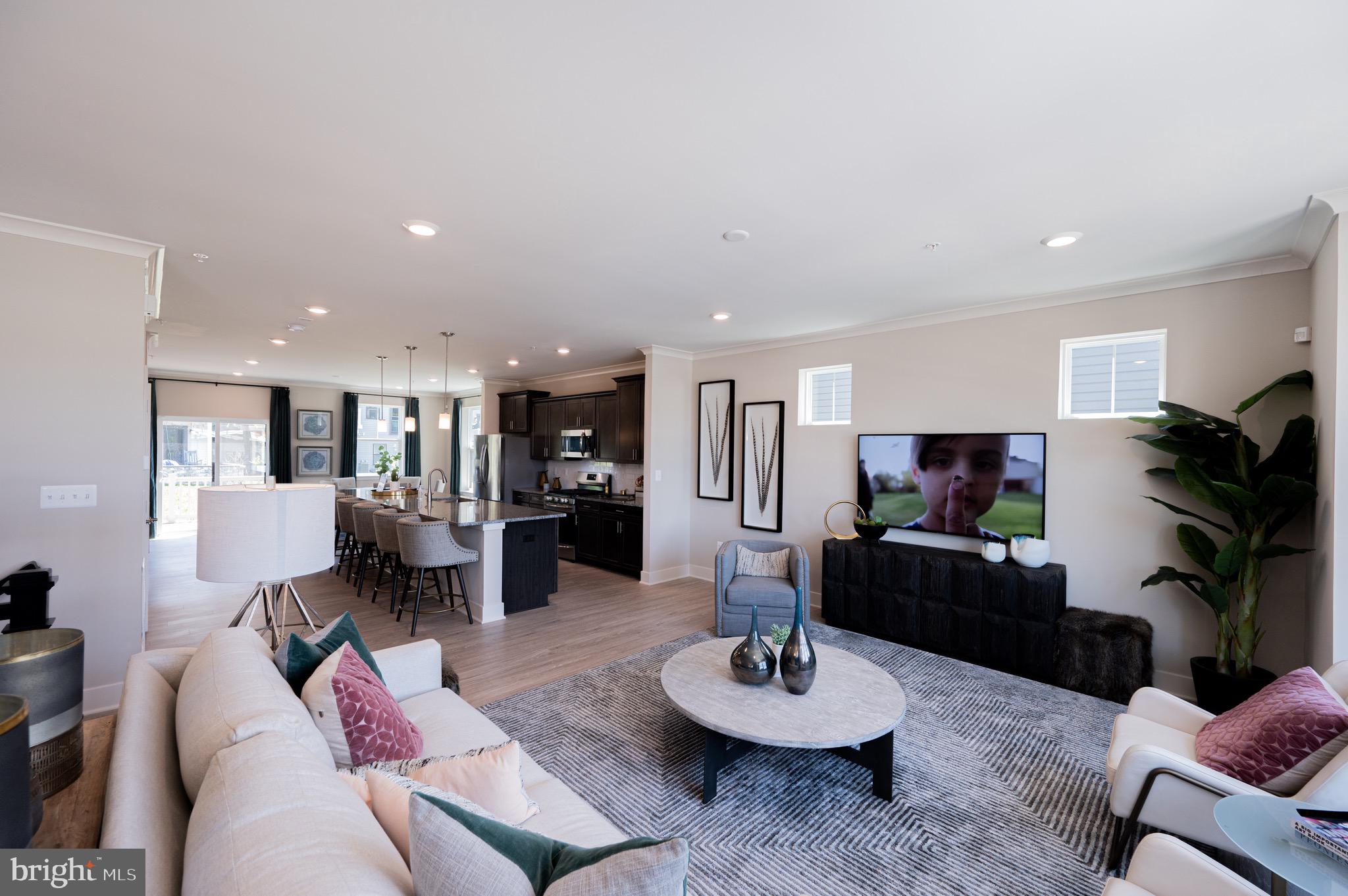 7209 Paper Way Glen Burnie, MD 21060 - Photo 11 of 40 a living room with furniture and a kitchen
