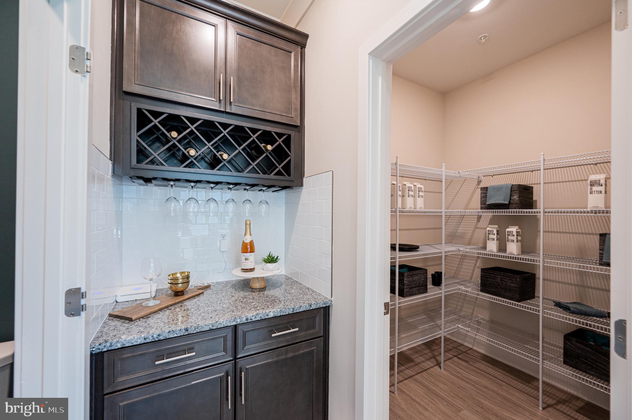7209 Paper Way Glen Burnie, MD 21060 - Photo 24 of 40 a kitchen with stainless steel appliances granite countertop a stove and a cabinets