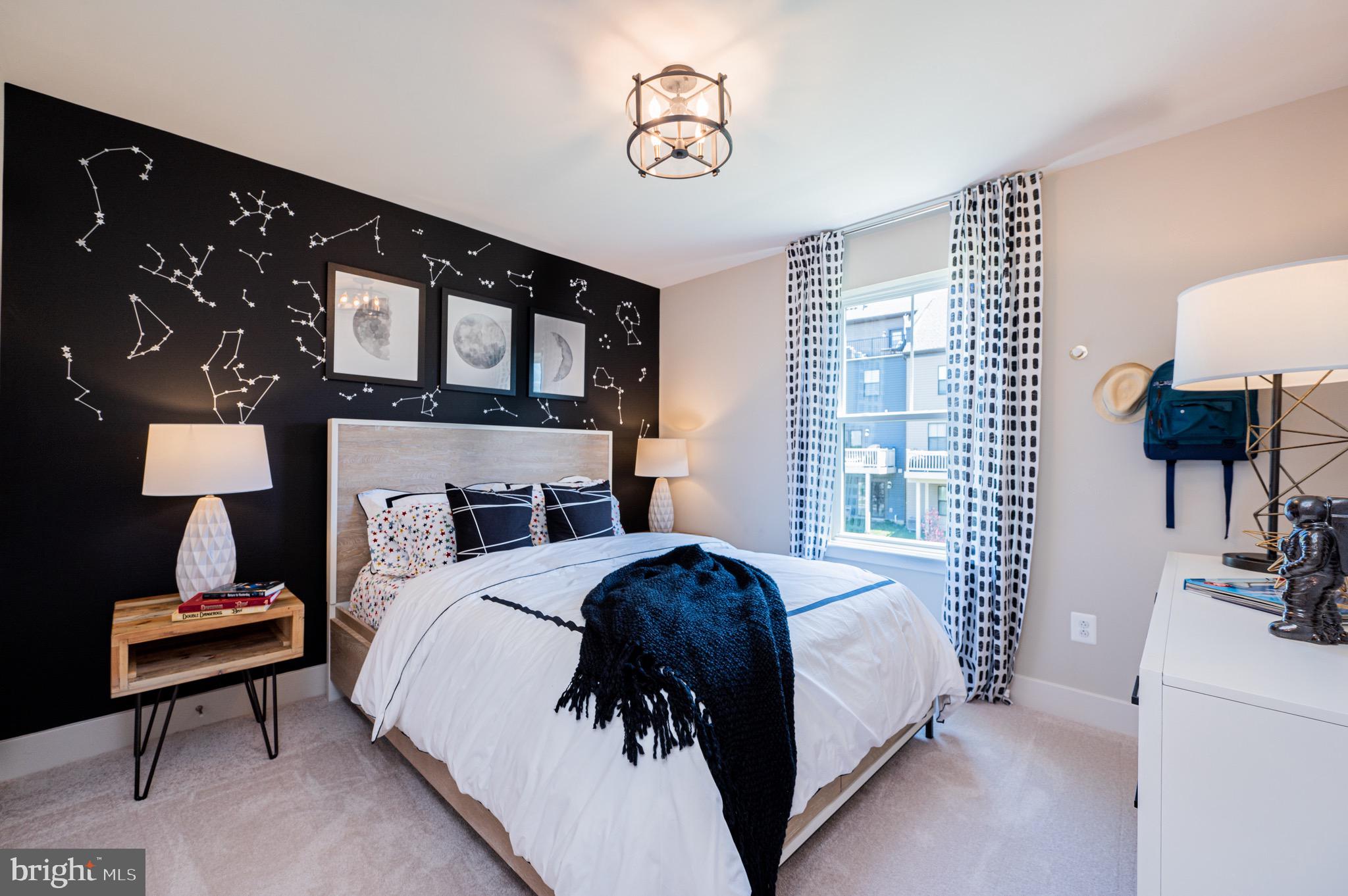 7209 Paper Way Glen Burnie, MD 21060 - Photo 26 of 40 a bed room with a bed window and a couch