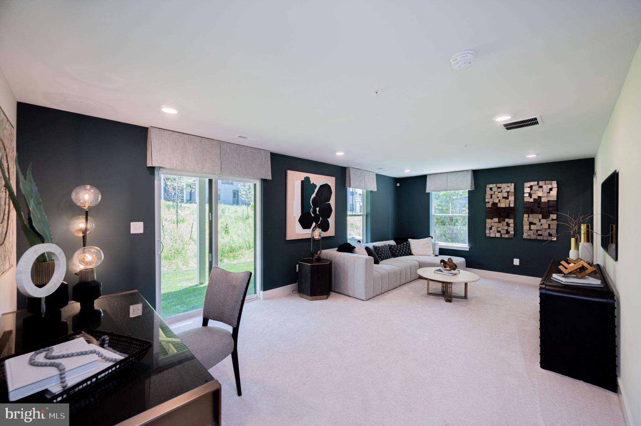 7209 Paper Way Glen Burnie, MD 21060 - Photo 3 of 40 a living room with furniture and a flat screen tv