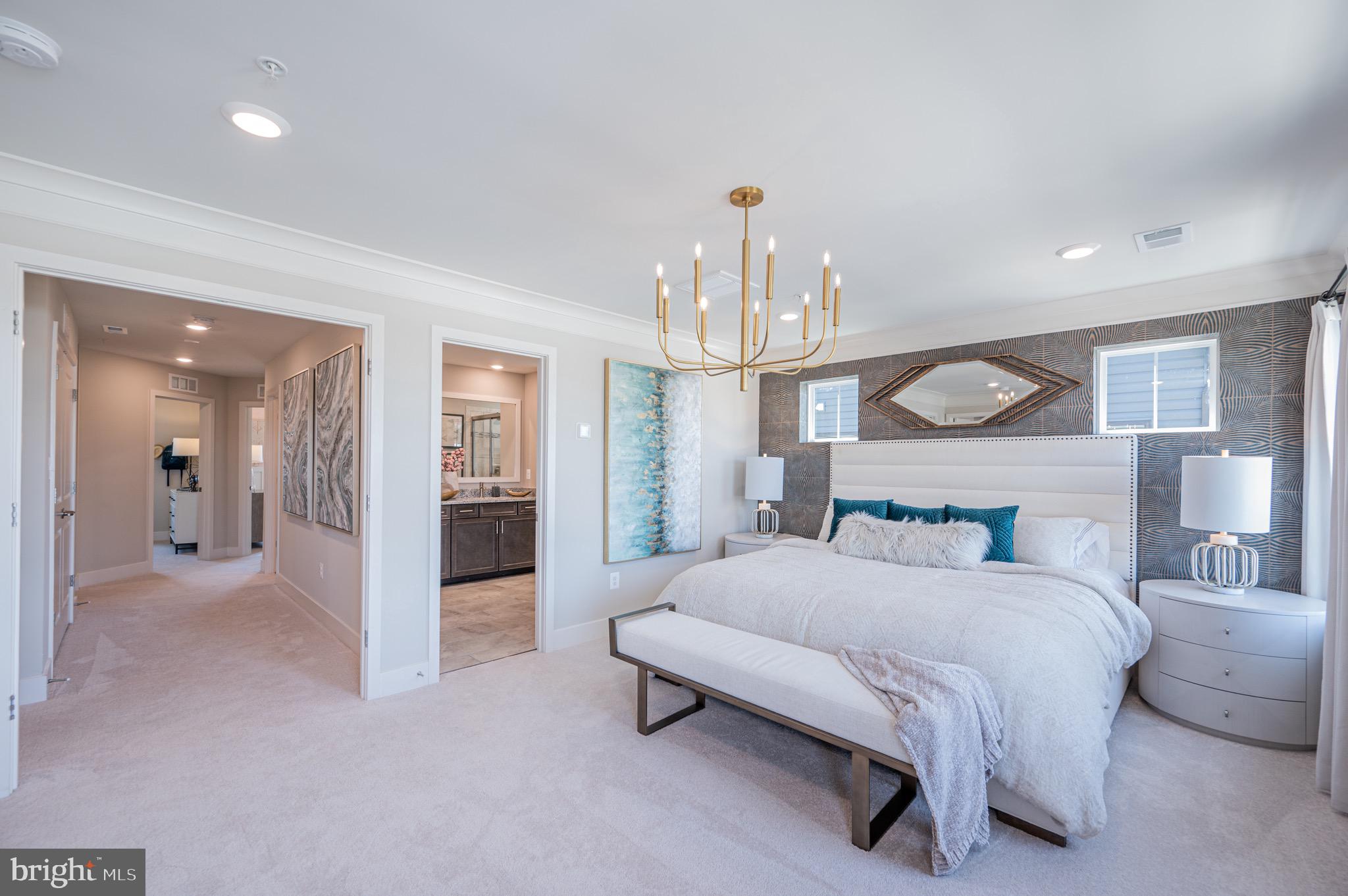 7209 Paper Way Glen Burnie, MD 21060 - Photo 31 of 40 a bedroom with a bed and a chandelier