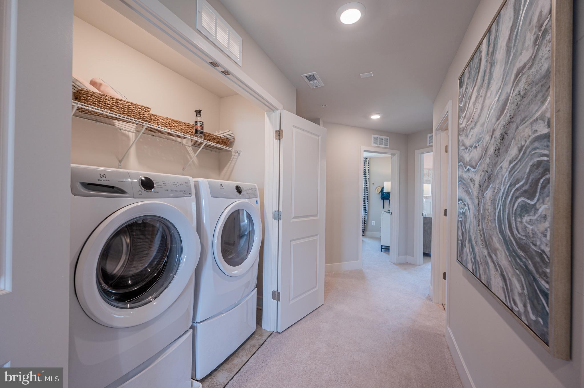 7209 Paper Way Glen Burnie, MD 21060 - Photo 32 of 40 a view of a hallway with washer and dryer