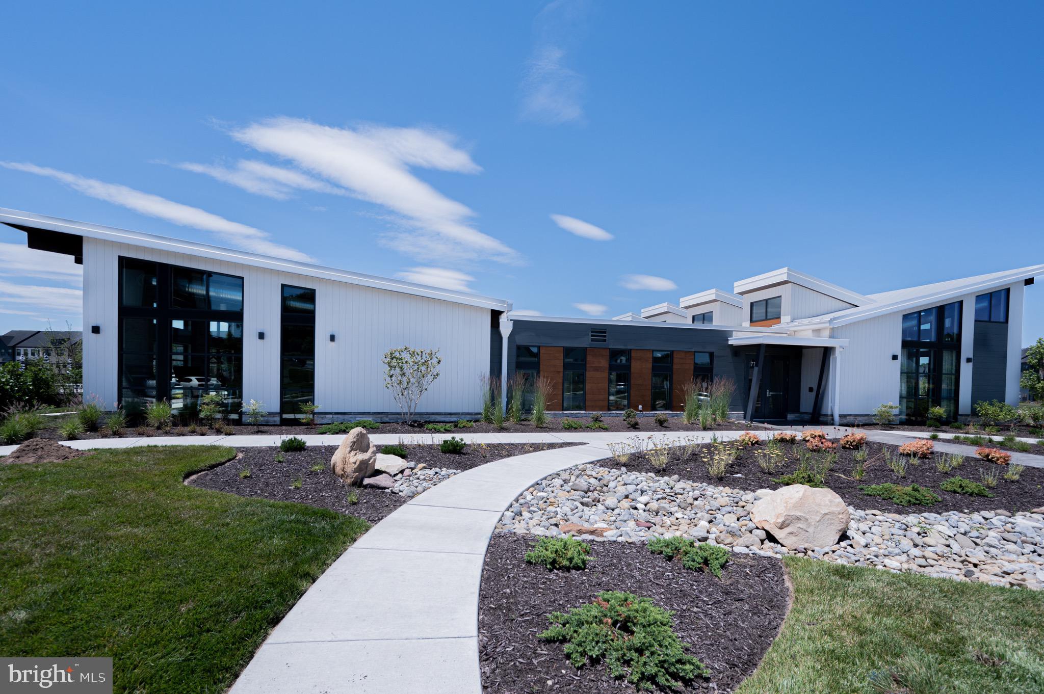 7209 Paper Way Glen Burnie, MD 21060 - Photo 39 of 40 a front view of a house with a yard and outdoor seating
