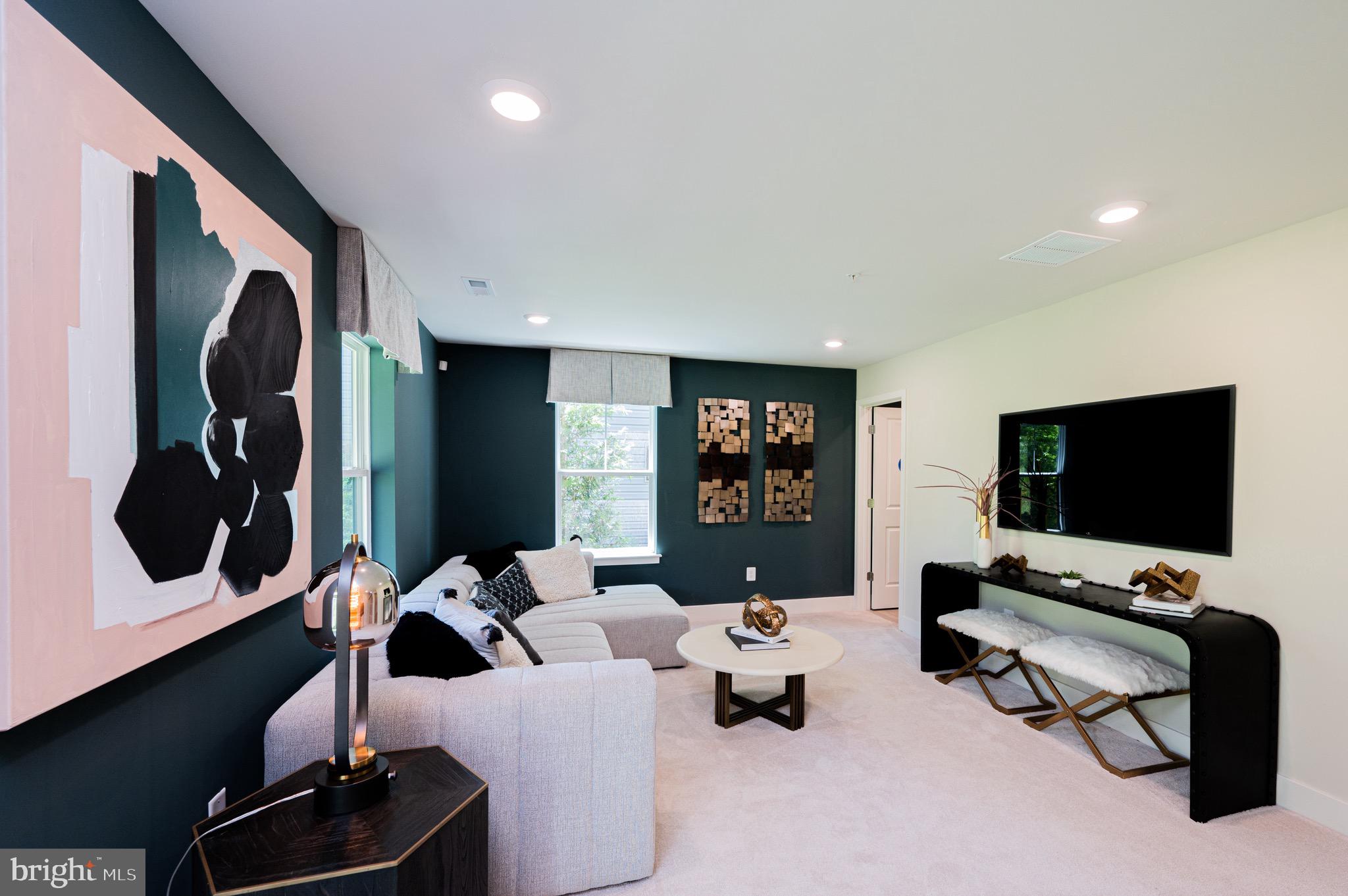 7209 Paper Way Glen Burnie, MD 21060 - Photo 5 of 40 a living room with furniture and a flat screen tv