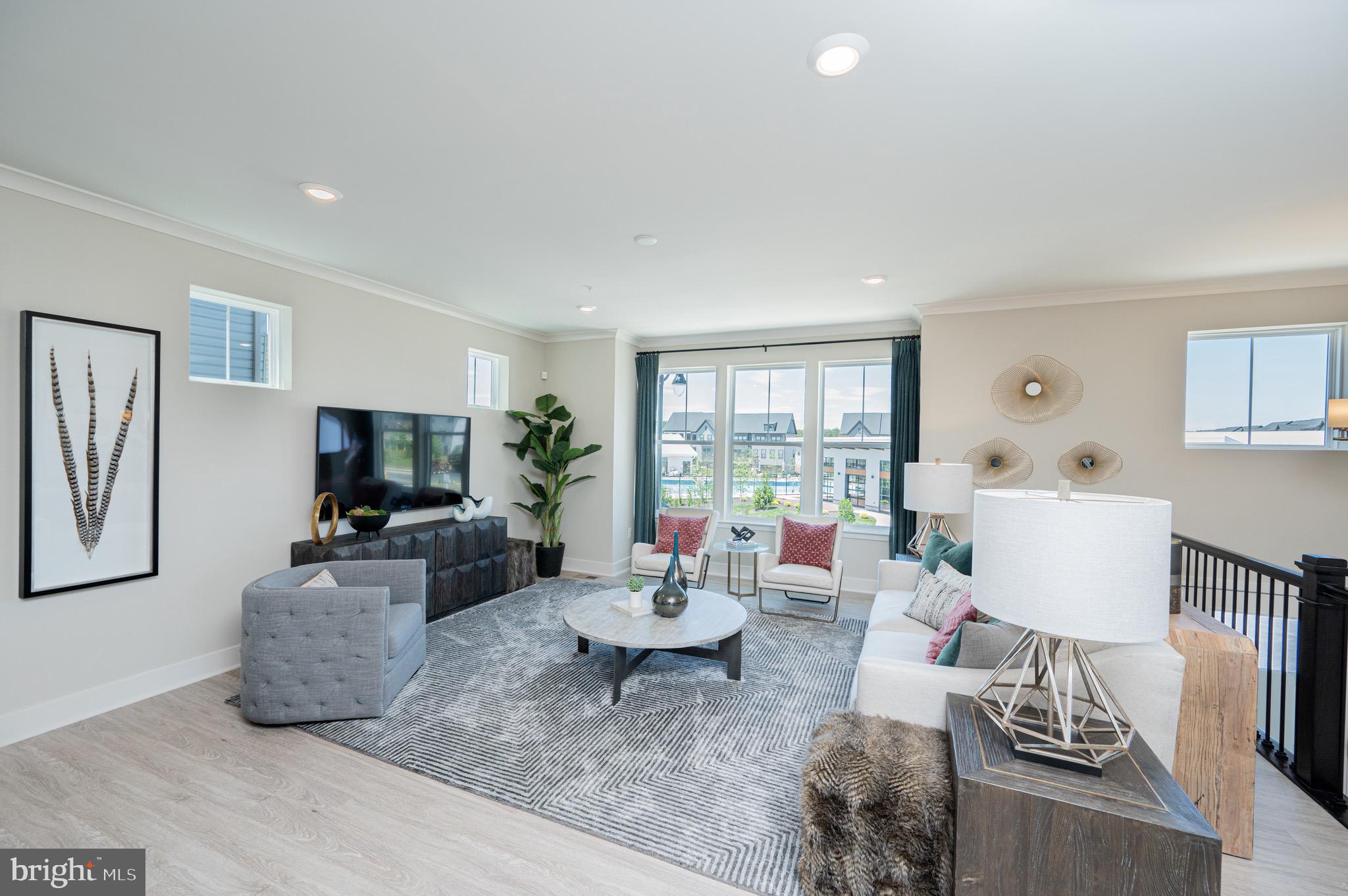 7209 Paper Way Glen Burnie, MD 21060 - Photo 7 of 40 a living room with furniture and a flat screen tv