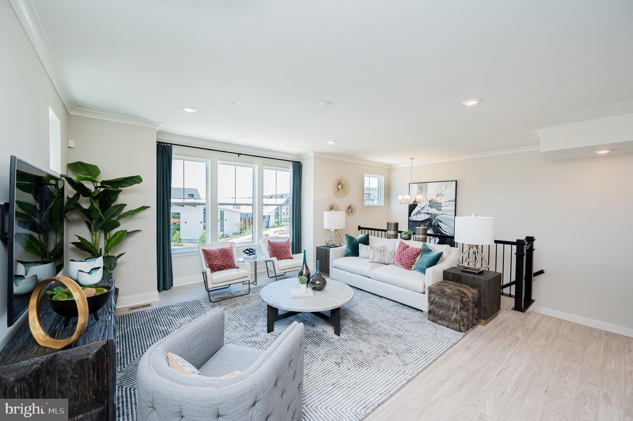 7209 Paper Way Glen Burnie, MD 21060 - Photo 8 of 40 a living room with furniture a window and a potted plant