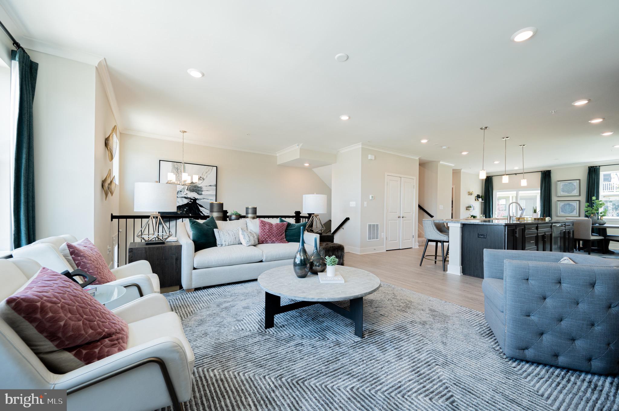 7209 Paper Way Glen Burnie, MD 21060 - Photo 9 of 40 a living room with furniture and a view of kitchen