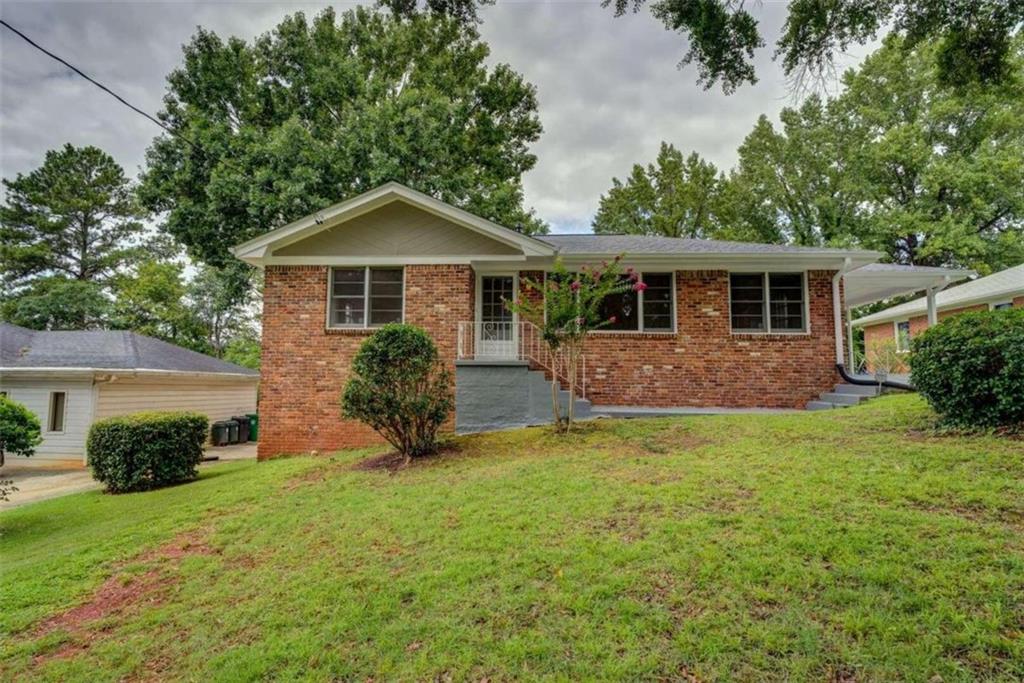 1781 Santa Cruz Drive Decatur, GA 30032 - Photo 1 of 1 a view of a house with a yard and potted plants