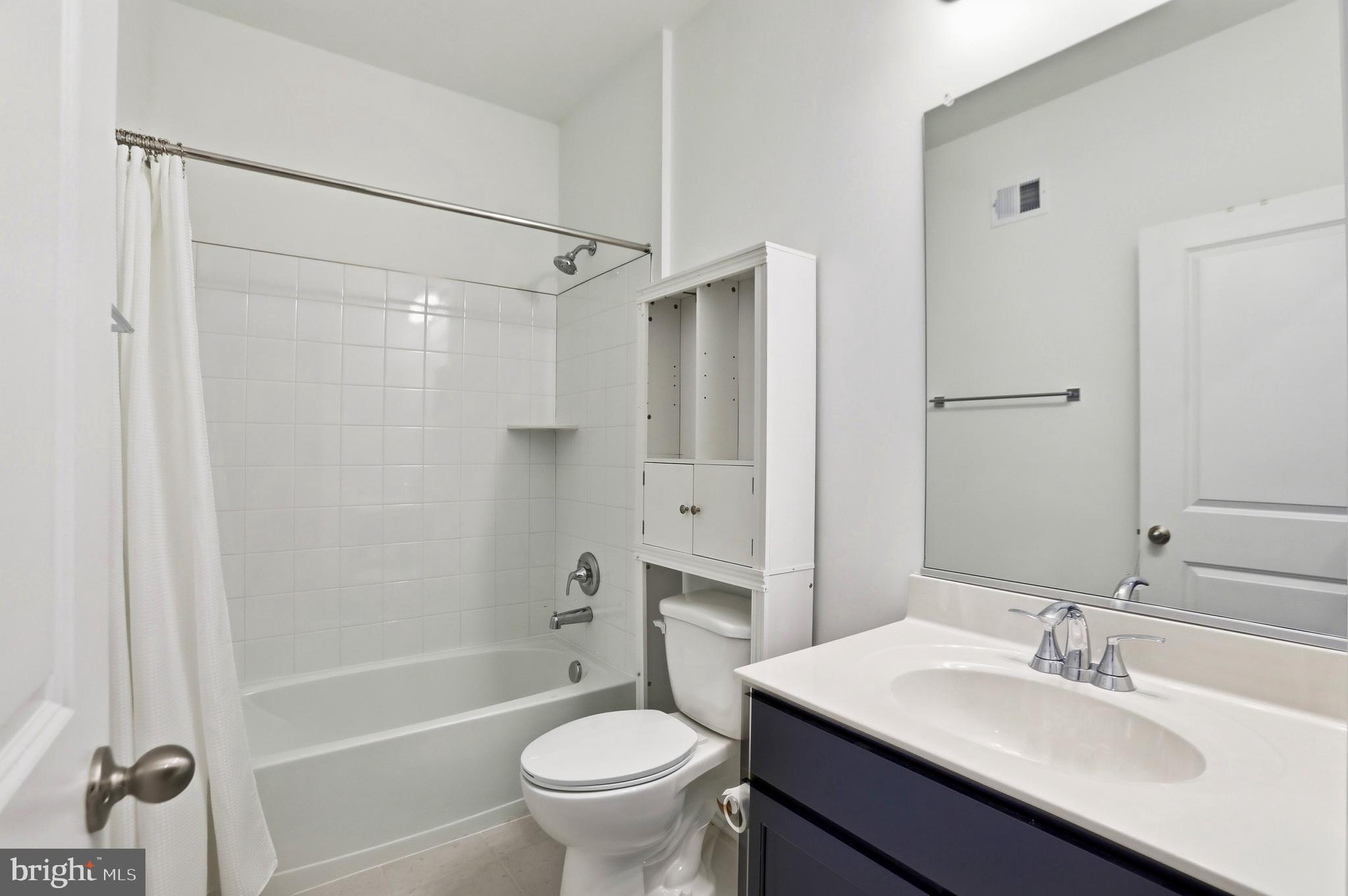 4965 Longmire Way Chantilly, VA 20151 - Photo 20 of 41 a bathroom with a sink toilet double vanity and shower
