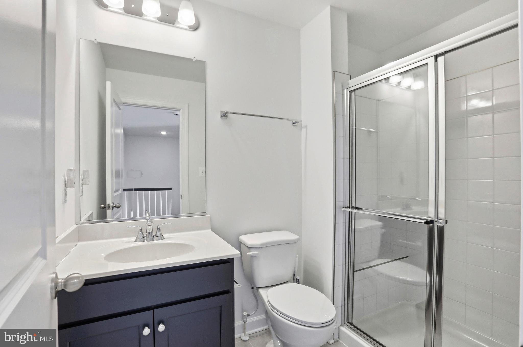 4965 Longmire Way Chantilly, VA 20151 - Photo 24 of 41 a bathroom with a sink toilet and shower