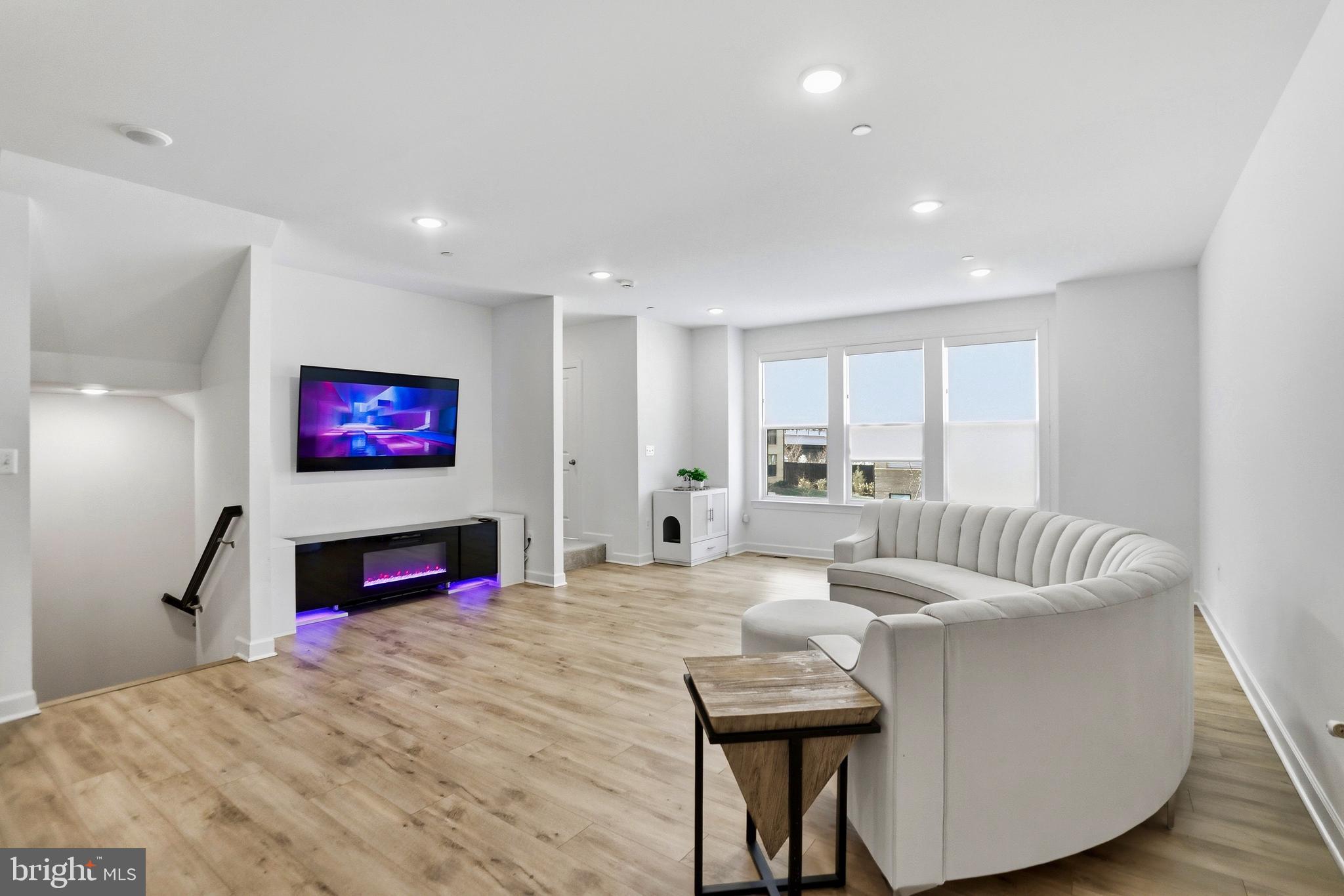 4965 Longmire Way Chantilly, VA 20151 - Photo 3 of 41 a living room with furniture and a flat screen tv