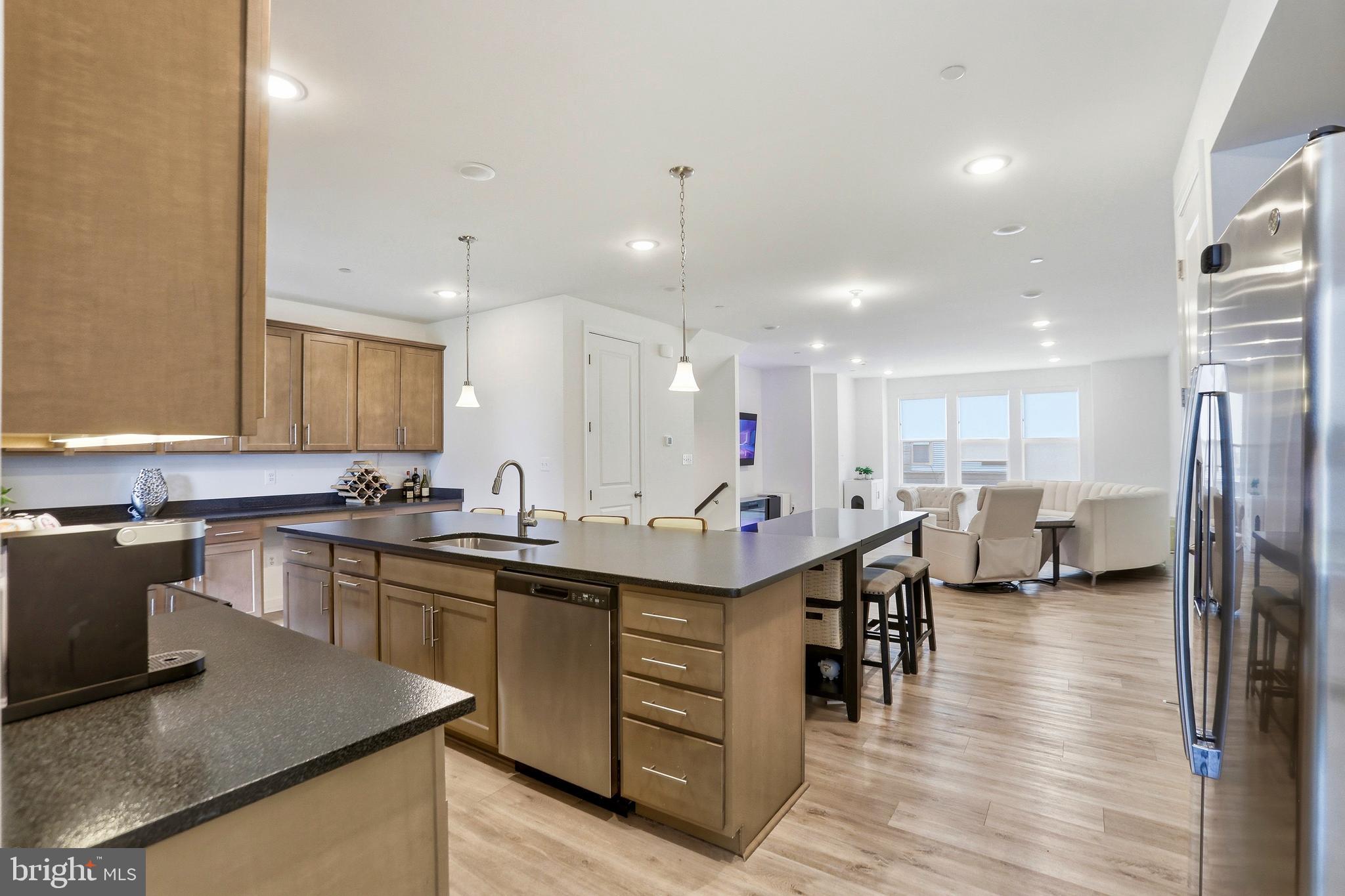 4965 Longmire Way Chantilly, VA 20151 - Photo 4 of 41 a kitchen with lots of counter top space and stainless steel appliances