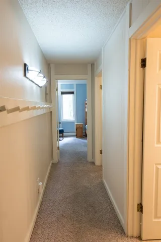 a view of a chairs and table in the balcony
