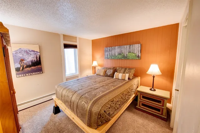 a bedroom with bed and a window