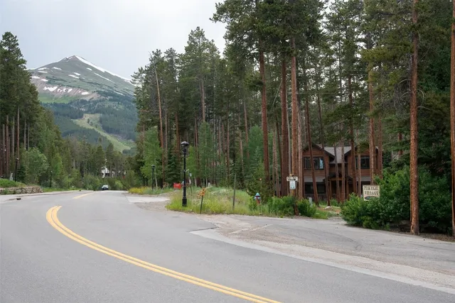 a view of a street with a building in the background