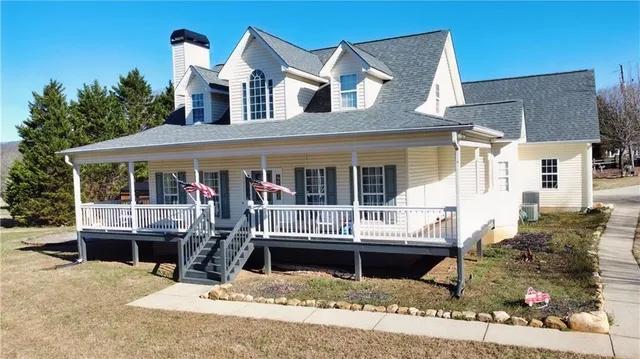 front view of a house with a rug