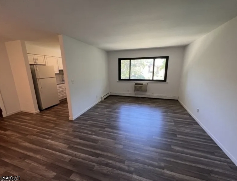 401 Highway 22 Plainfield, NJ 07060 - Photo 4 of 9 an empty room with wooden floor and windows