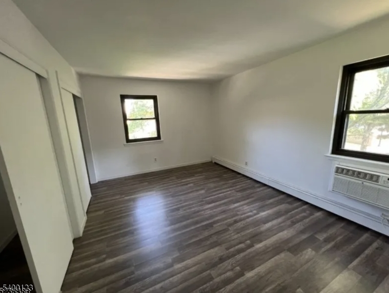401 Highway 22 Plainfield, NJ 07060 - Photo 5 of 9 an empty room with wooden floor and windows