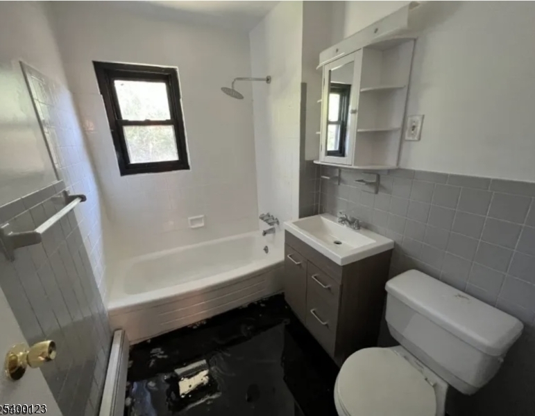 401 Highway 22 Plainfield, NJ 07060 - Photo 6 of 9 a bathroom with a sink toilet vanity and bathtub