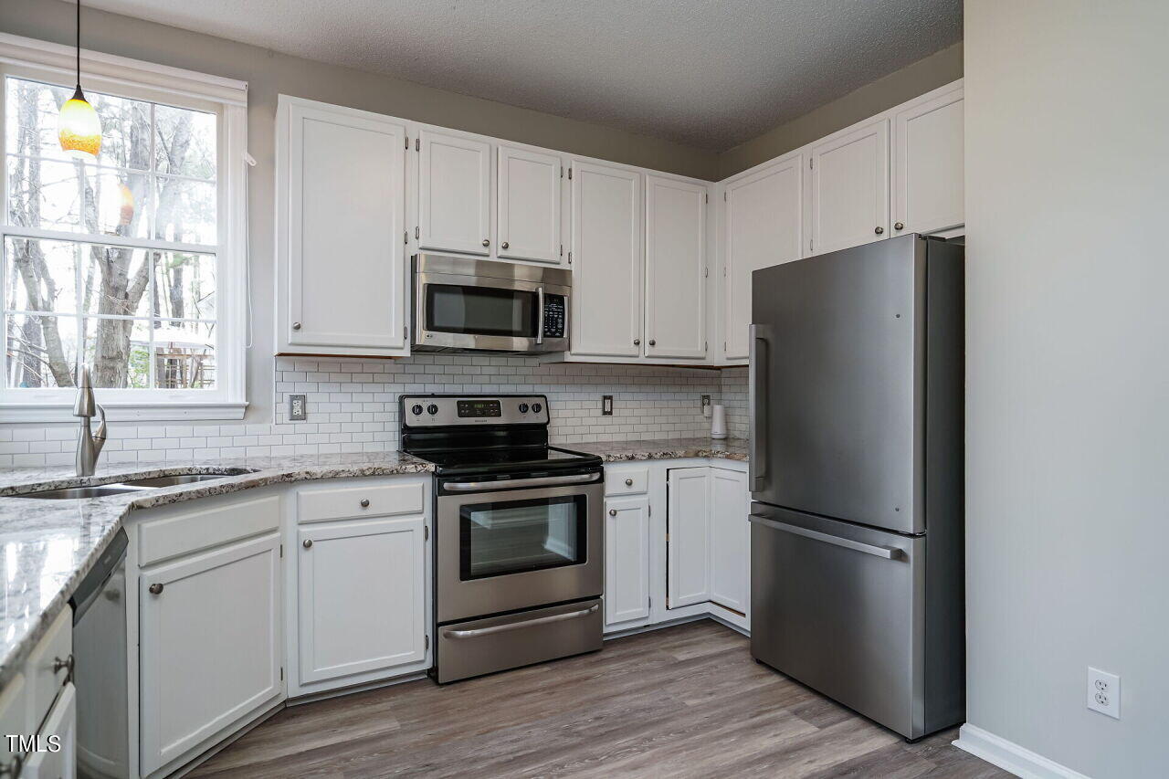 9312 Carisbrook Court Raleigh, NC 27615 - Photo 12 of 30 013-1280x960-kitchen