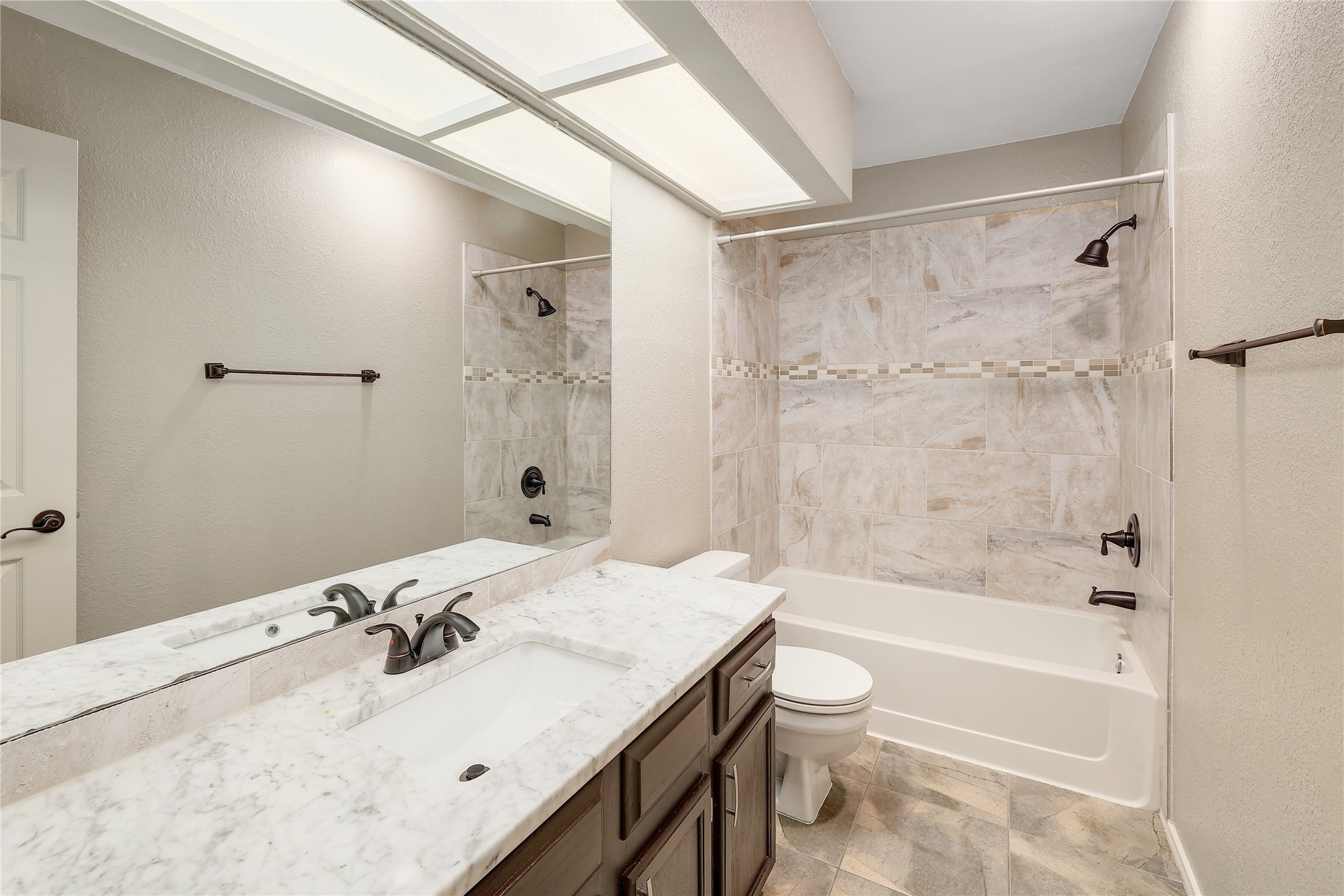 409 Cedar Mound Pass Cedar Park, TX 78613 - Photo 14 of 18 a bathroom with a granite countertop sink a toilet and shower