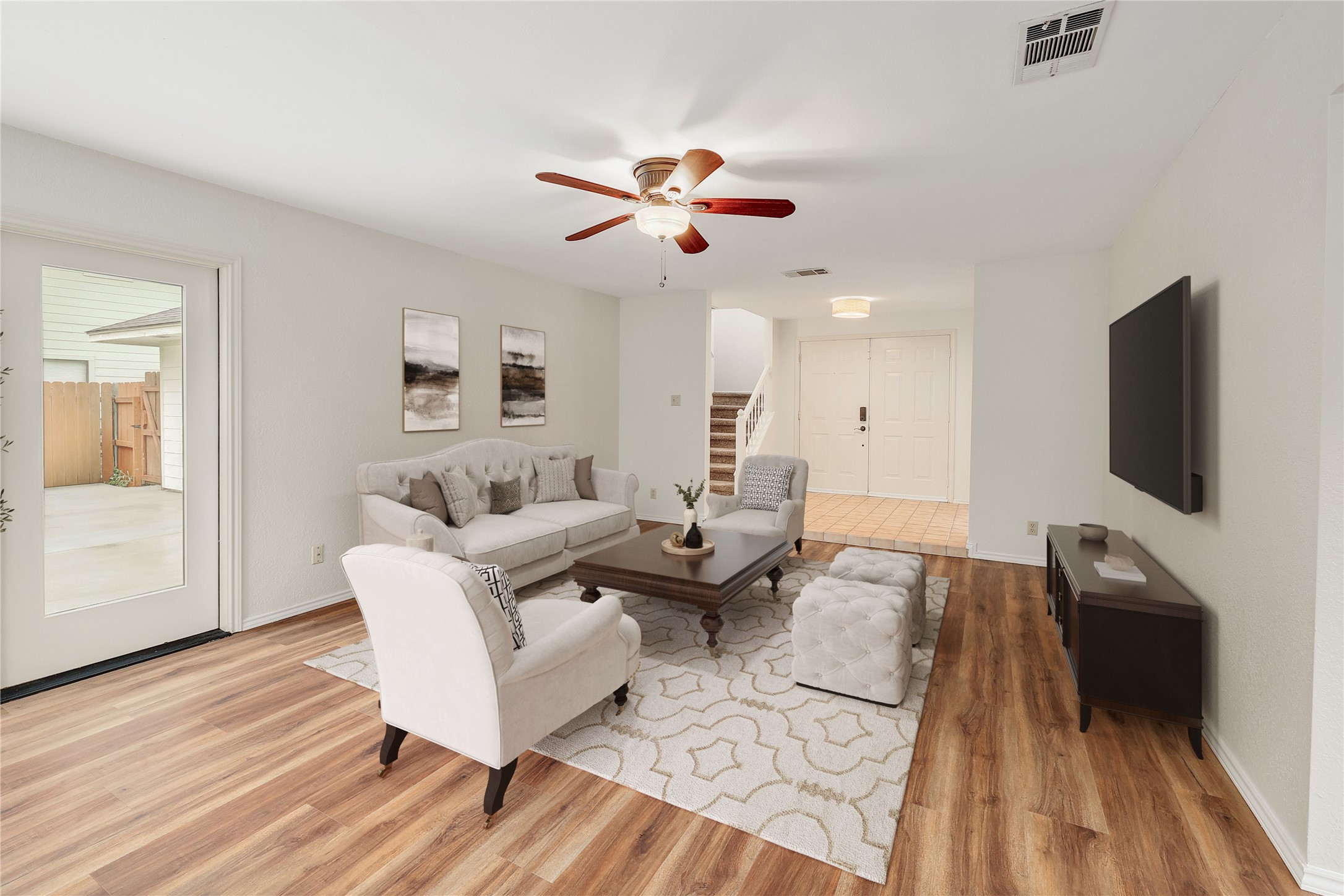 409 Cedar Mound Pass Cedar Park, TX 78613 - Photo 4 of 18 a living room with furniture a flat screen tv and a wooden floor