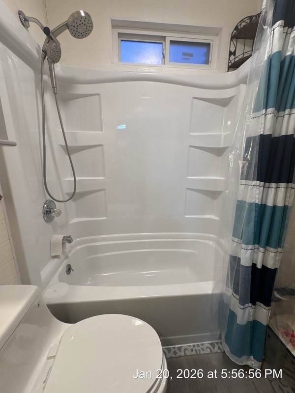 527 2nd Street Bayside, TX 78340 - Photo 13 of 32 a bathroom with a bathtub and a shower