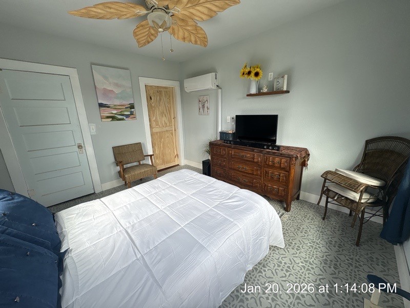 527 2nd Street Bayside, TX 78340 - Photo 15 of 32 a bedroom with a bed and a chair