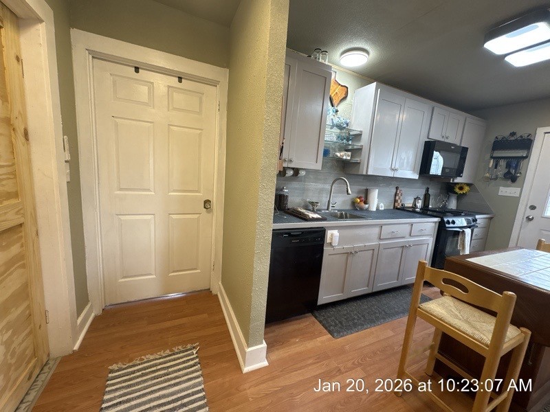 527 2nd Street Bayside, TX 78340 - Photo 17 of 32 a kitchen with a sink appliances and cabinets