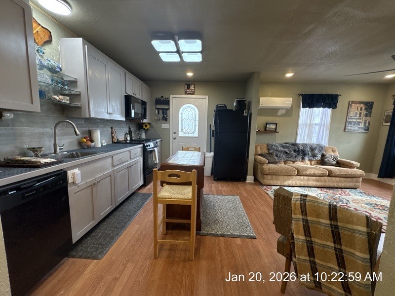 527 2nd Street Bayside, TX 78340 - Photo 18 of 32 a kitchen with stainless steel appliances granite countertop a sink stove and refrigerator