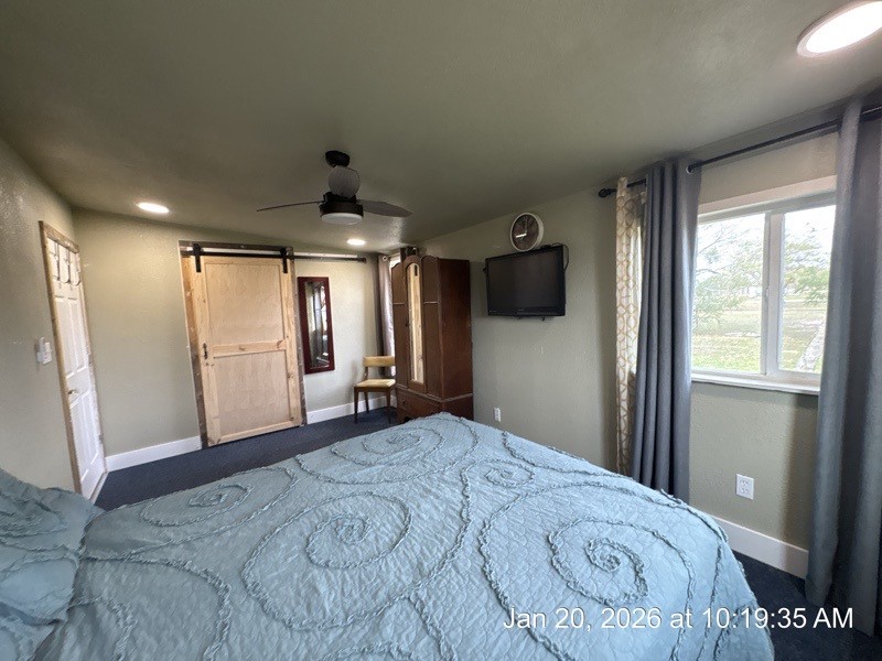 527 2nd Street Bayside, TX 78340 - Photo 19 of 32 a spacious bedroom with a large bed and a large window
