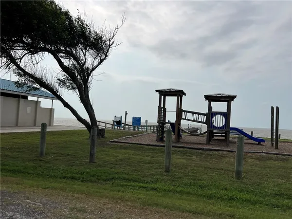 a view of a garden with an ocean view