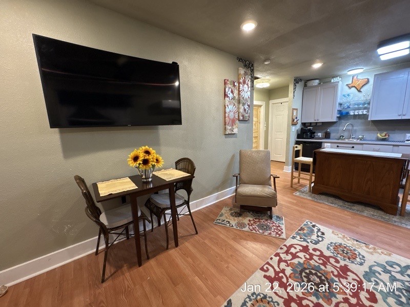 527 2nd Street Bayside, TX 78340 - Photo 3 of 32 a living room with furniture a flat screen tv and kitchen view