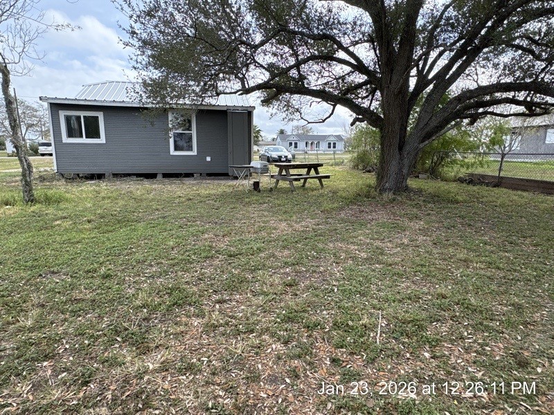 527 2nd Street Bayside, TX 78340 - Photo 31 of 32 a house with trees in front of it