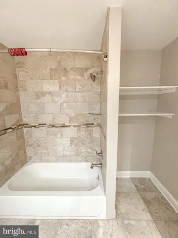 a bathroom with a bath tub