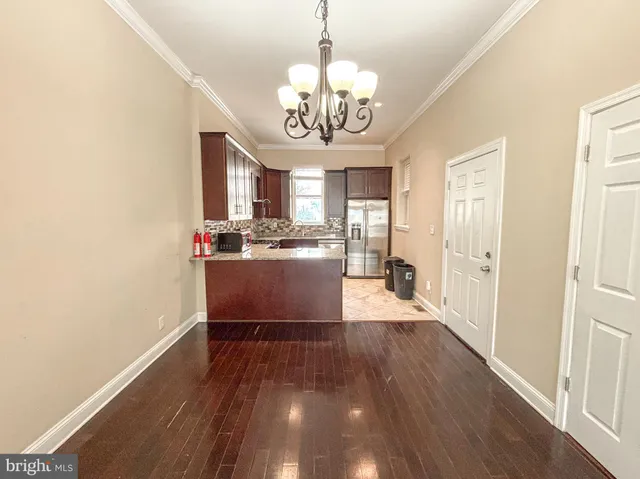 a view of a kitchen from the hallway