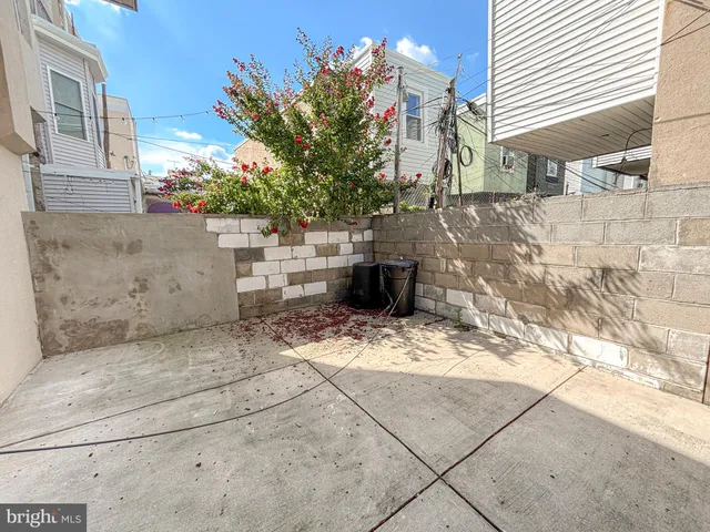 a view of a backyard with sitting area