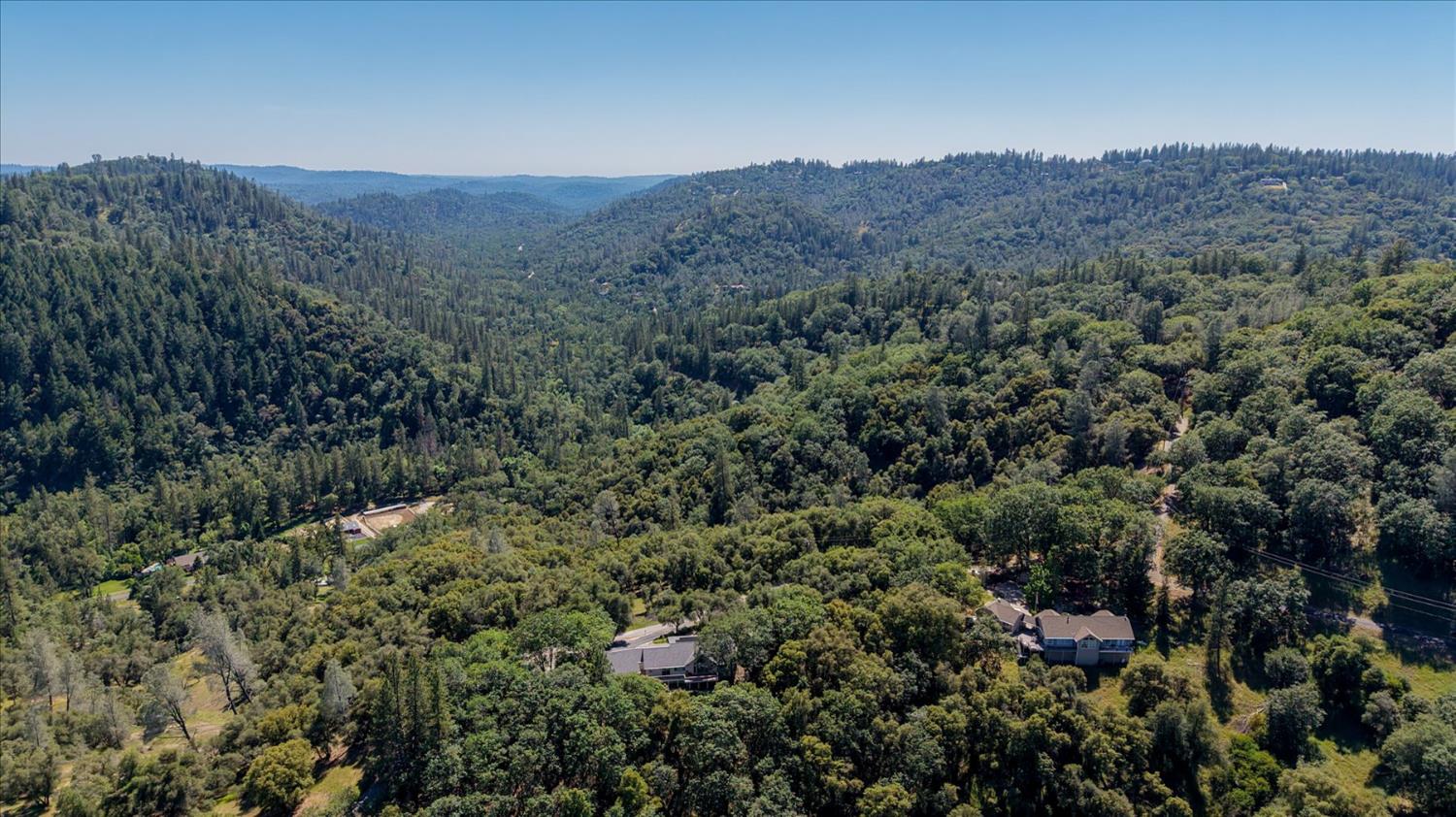 18639 Fay Ridge Court Grass Valley, CA 95949 - Photo 74 of 99 a view of a lush green hillside and a houses