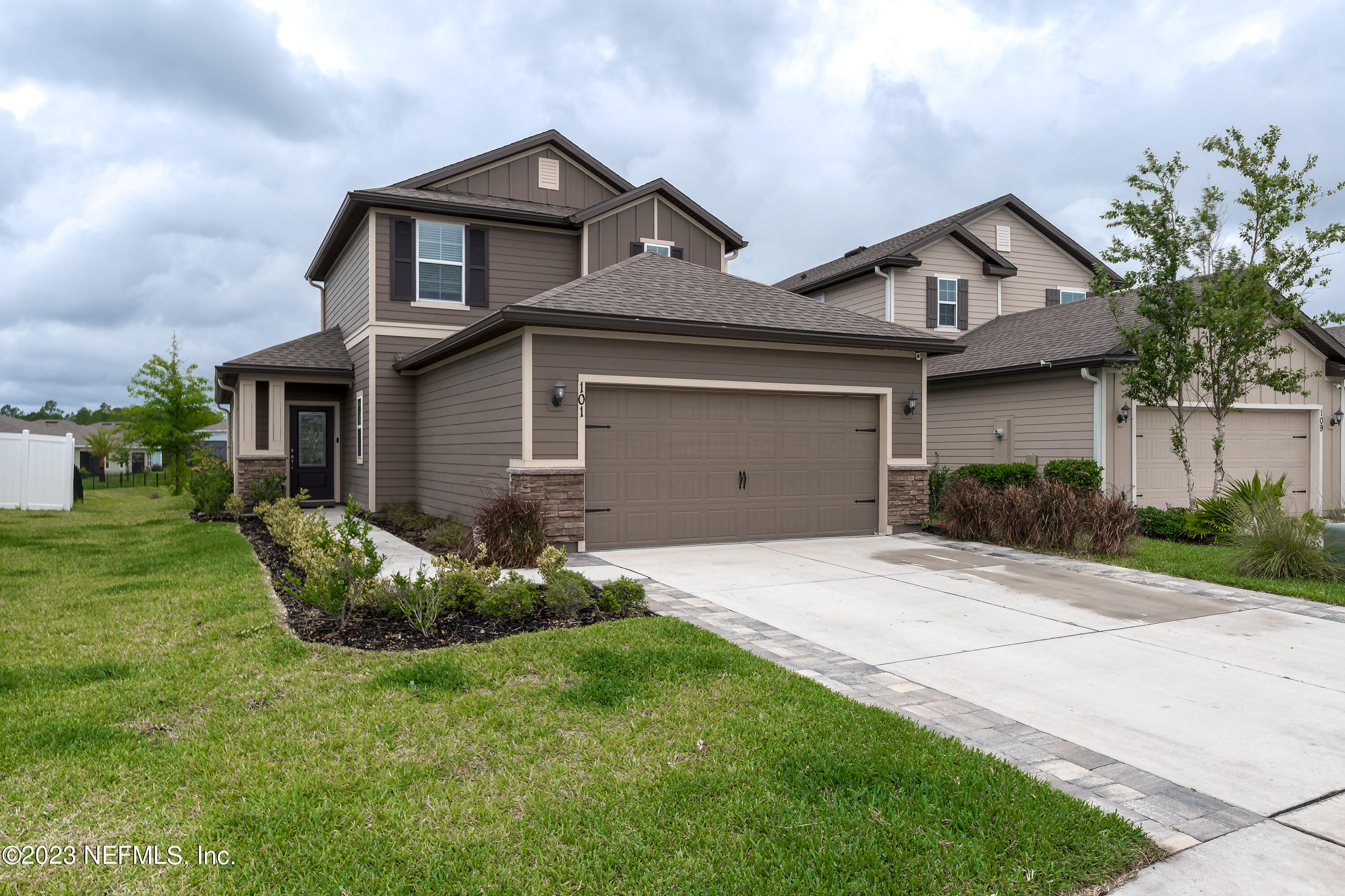 101 Deer Trail St. Augustine, FL 32095 - Photo 1 of 22 a front view of a house with a garden and plants