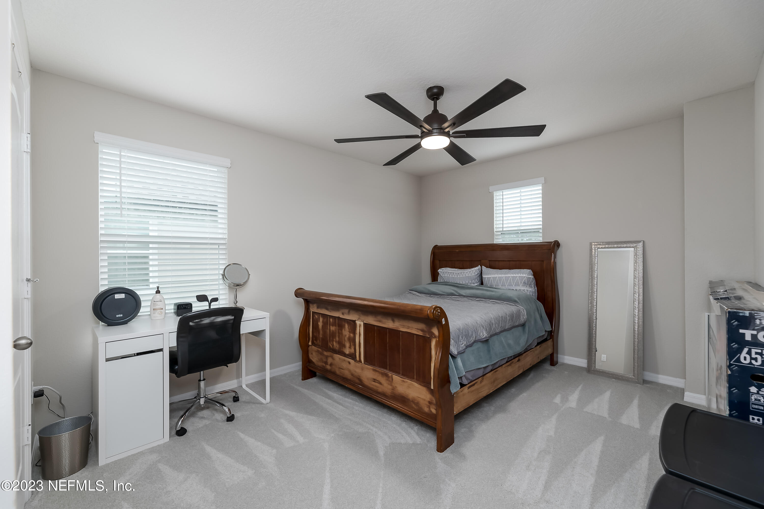 101 Deer Trail St. Augustine, FL 32095 - Photo 15 of 22 a bedroom with a bed and a table in it