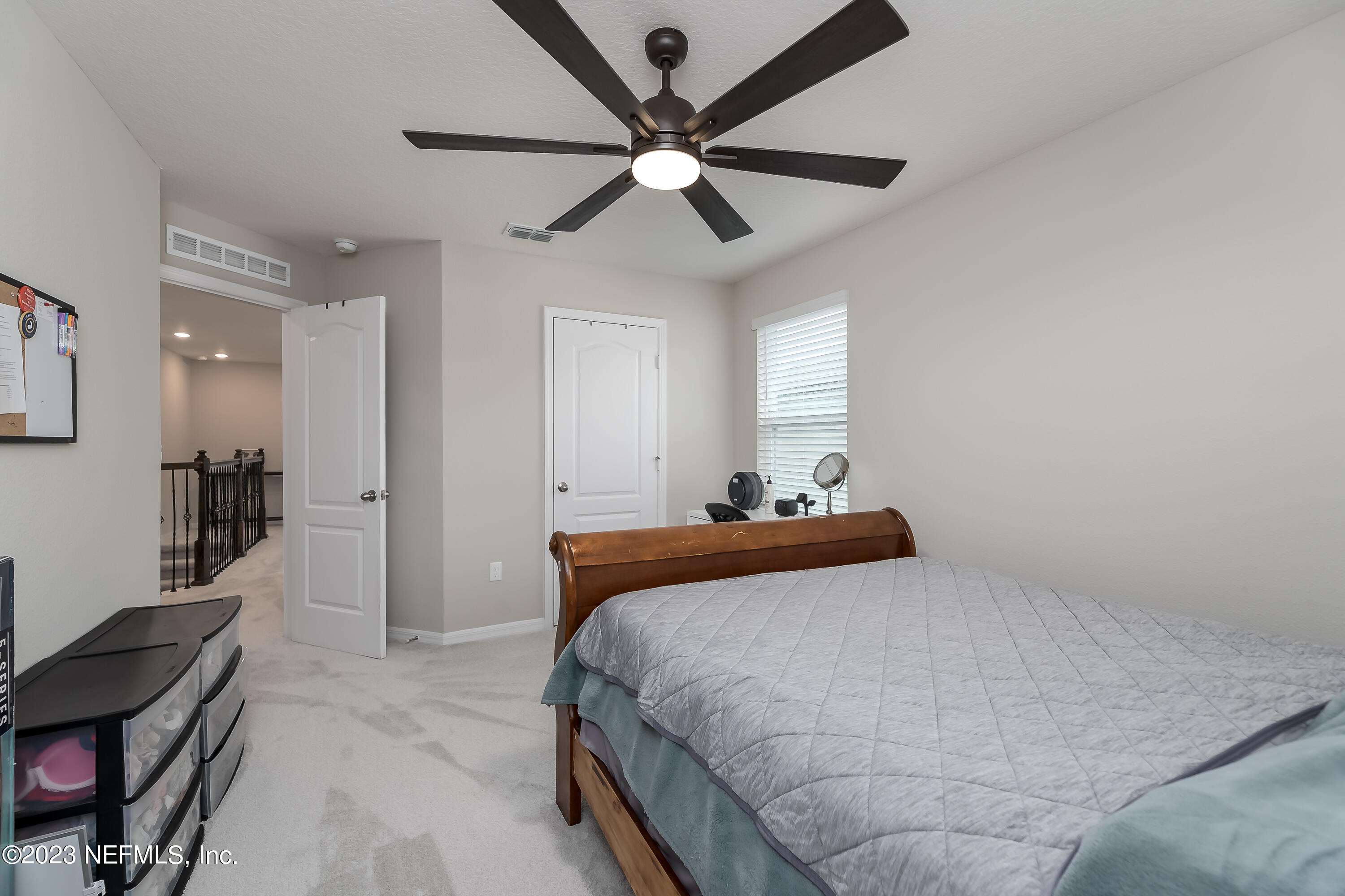 101 Deer Trail St. Augustine, FL 32095 - Photo 16 of 22 a bedroom with a bed and a ceiling fan