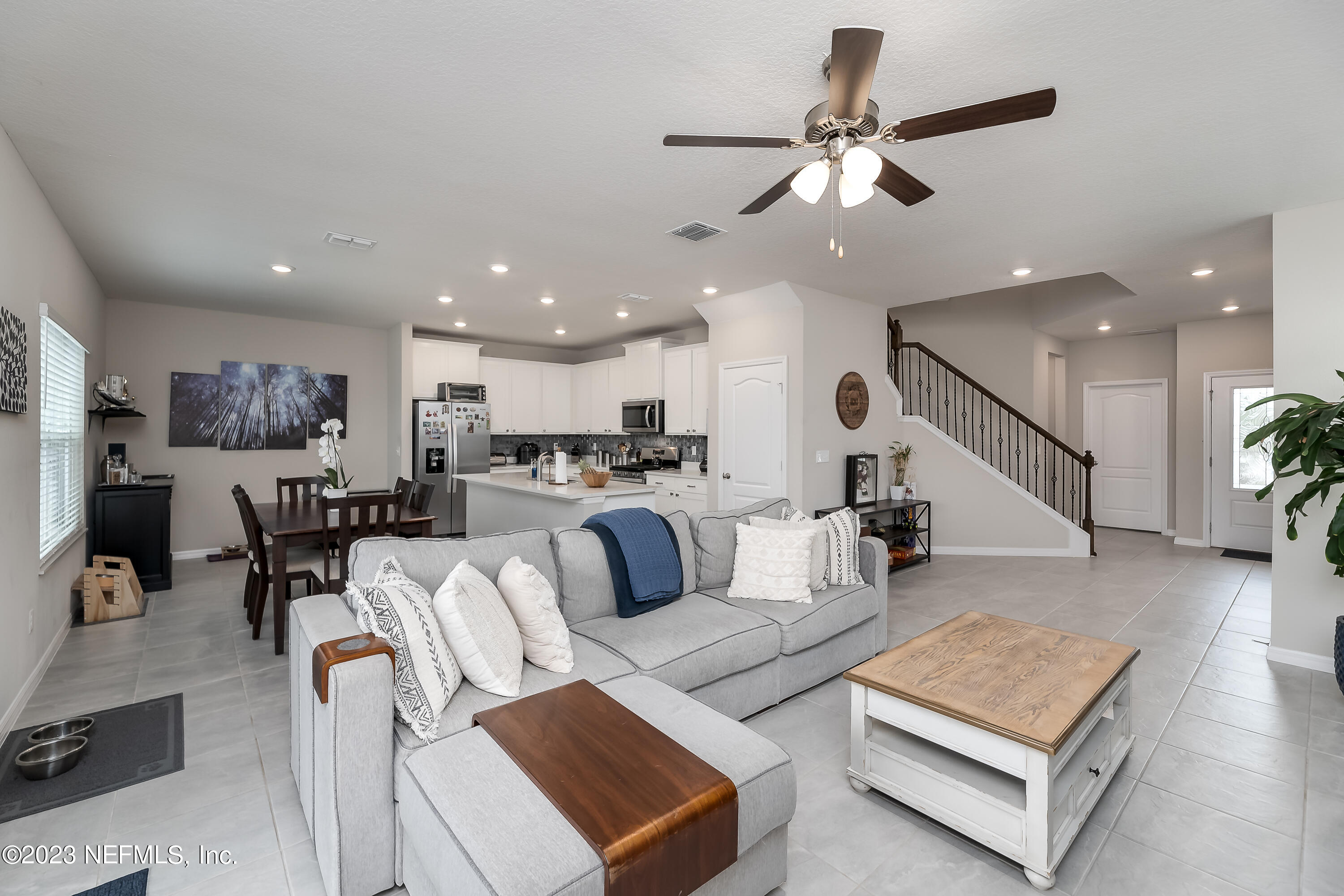 101 Deer Trail St. Augustine, FL 32095 - Photo 2 of 22 a living room with furniture kitchen view and a chandelier