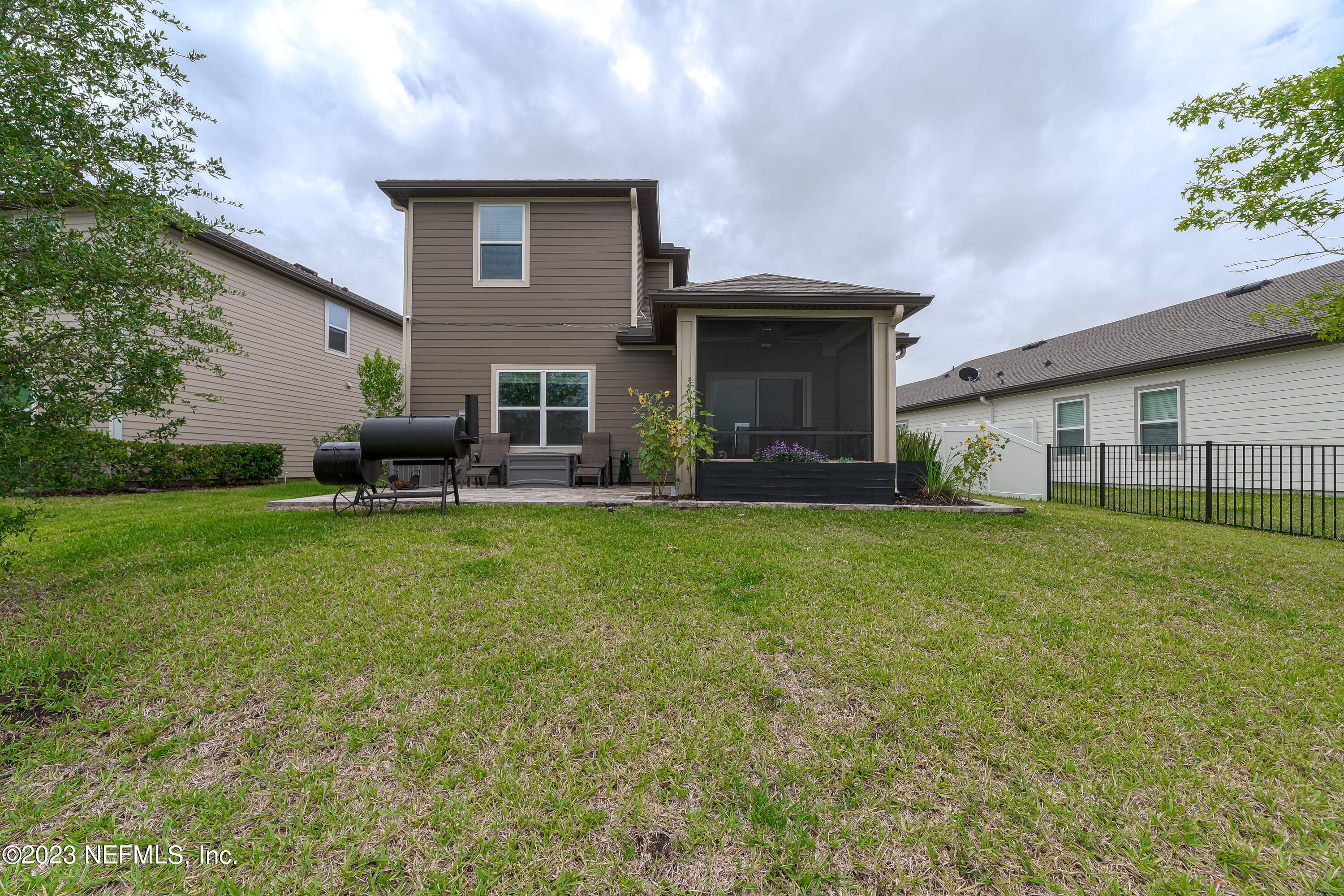 101 Deer Trail St. Augustine, FL 32095 - Photo 21 of 22 a front view of house with yard and outdoor seating