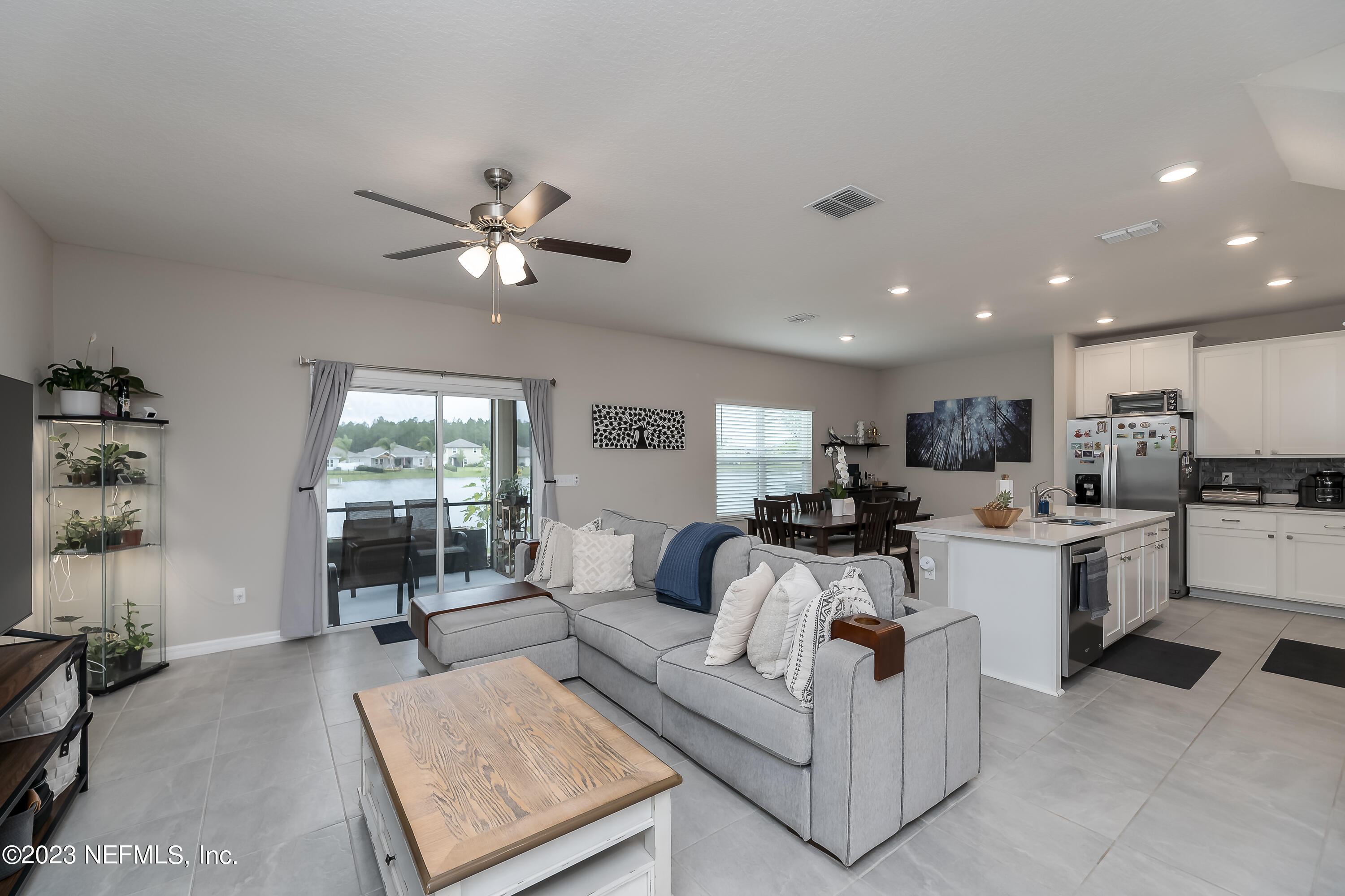 101 Deer Trail St. Augustine, FL 32095 - Photo 3 of 22 a living room with furniture kitchen view and a large window