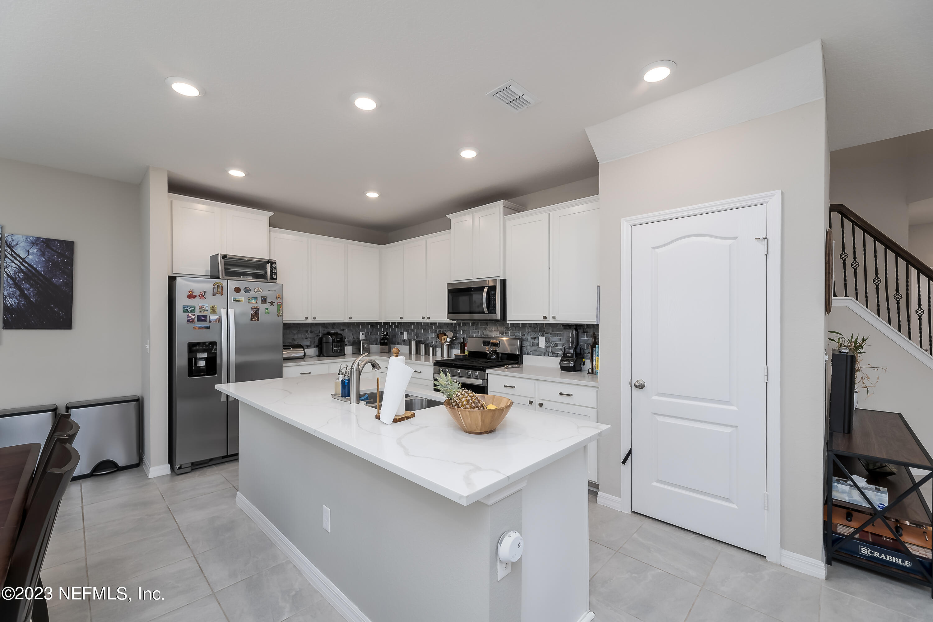 101 Deer Trail St. Augustine, FL 32095 - Photo 4 of 22 a kitchen with a sink stainless steel appliances and cabinets