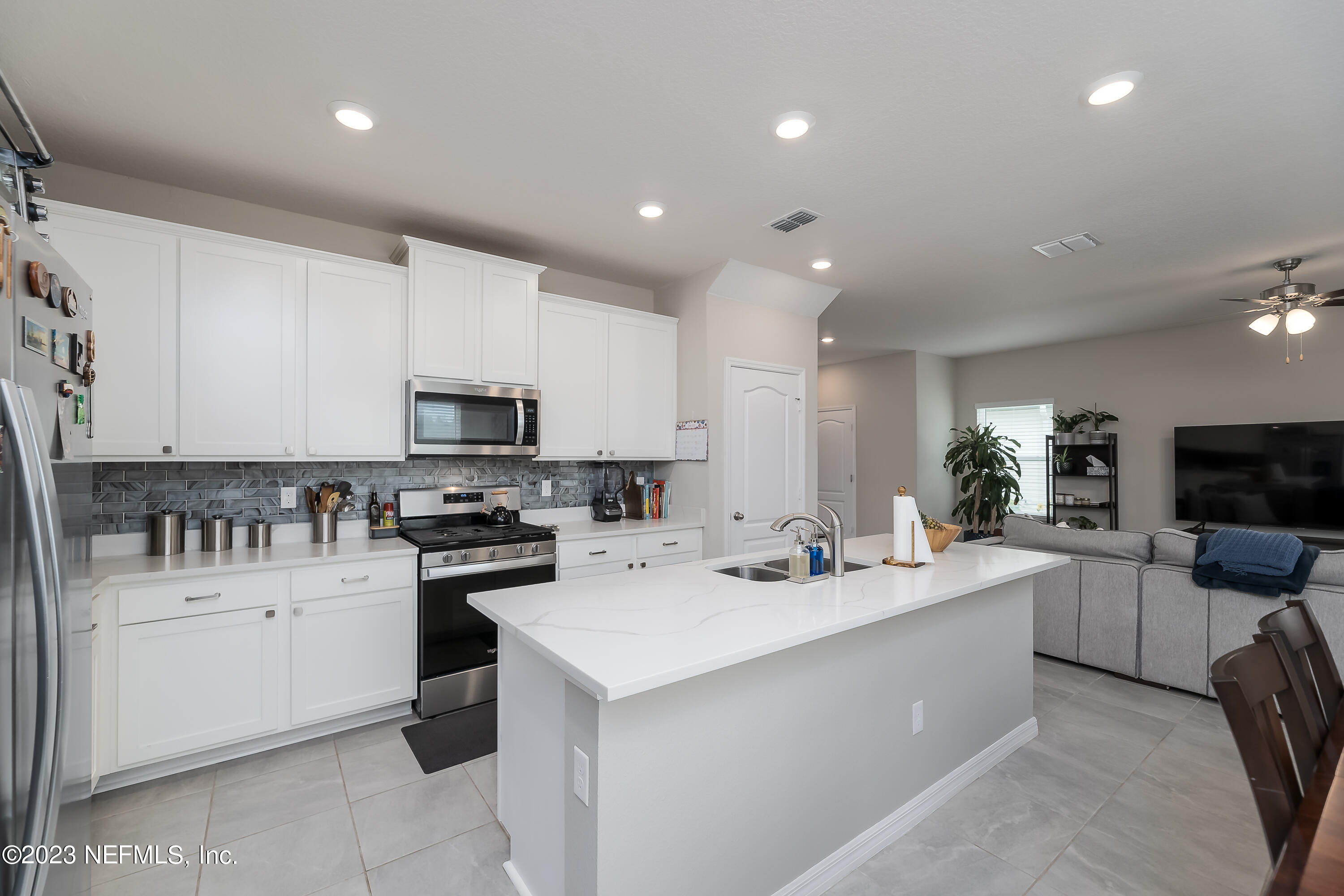 101 Deer Trail St. Augustine, FL 32095 - Photo 5 of 22 a kitchen with a sink stainless steel appliances and cabinets