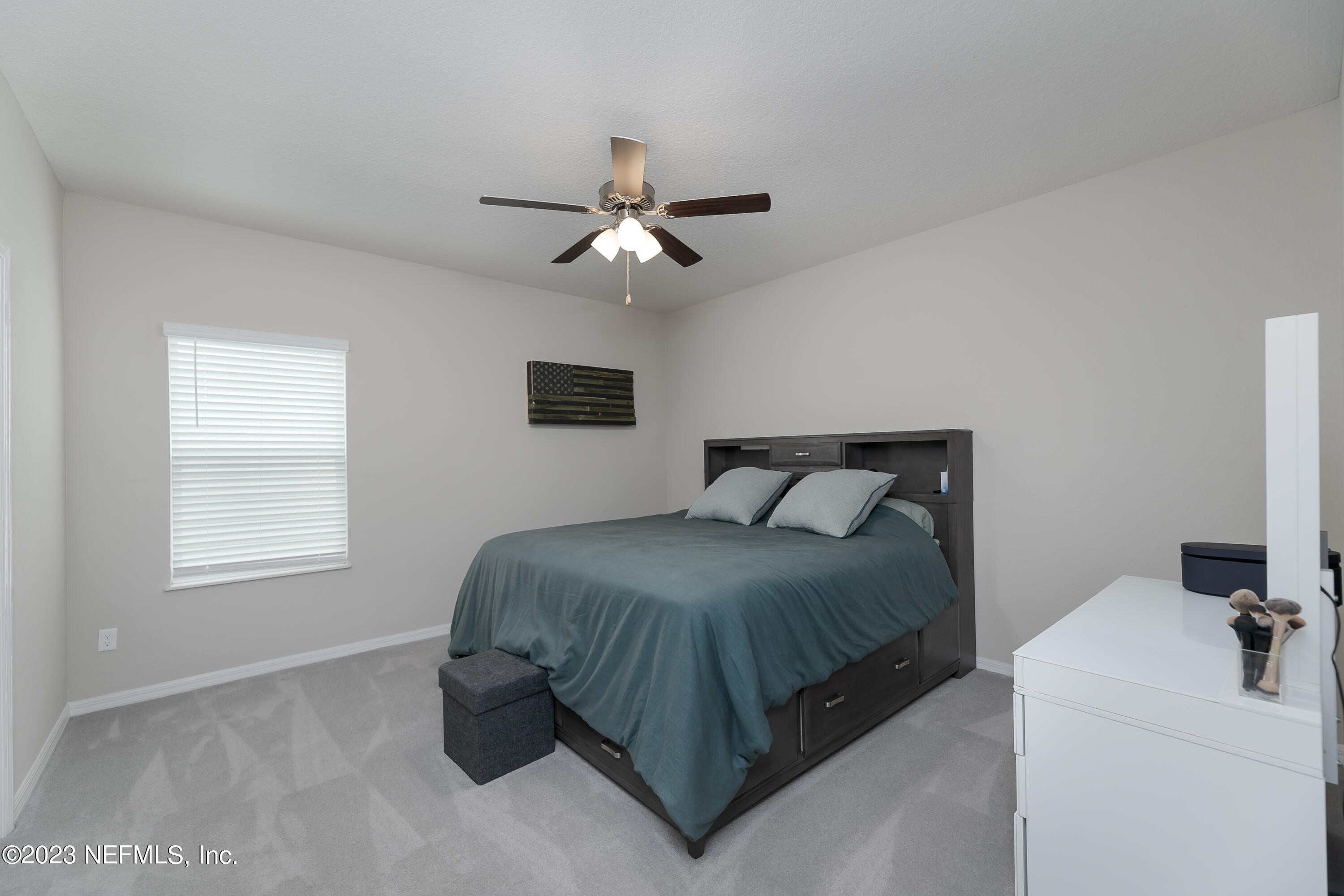 101 Deer Trail St. Augustine, FL 32095 - Photo 7 of 22 a bedroom with a bed and a chandelier