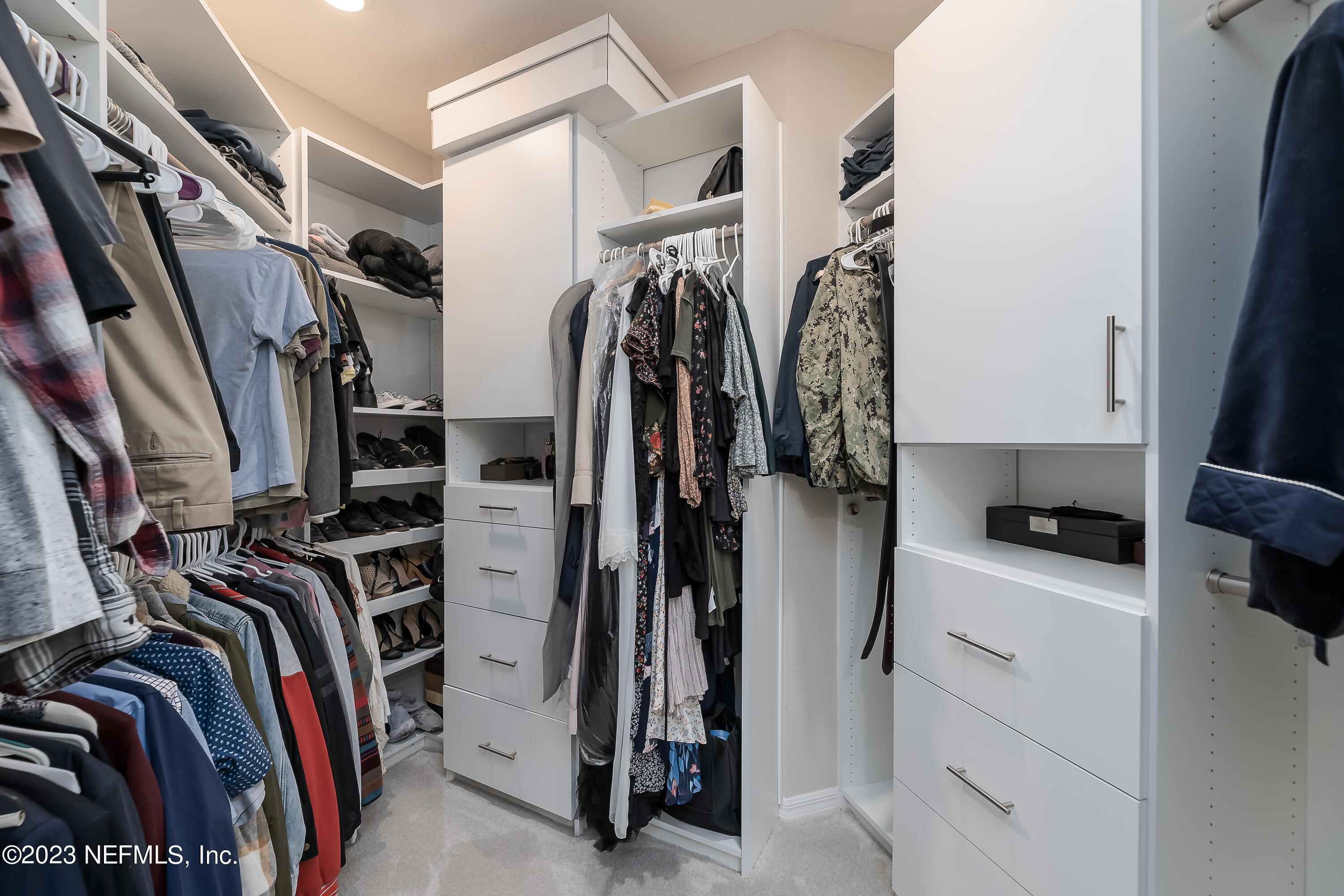 101 Deer Trail St. Augustine, FL 32095 - Photo 9 of 22 a view of walk in closet with clothes and shoes