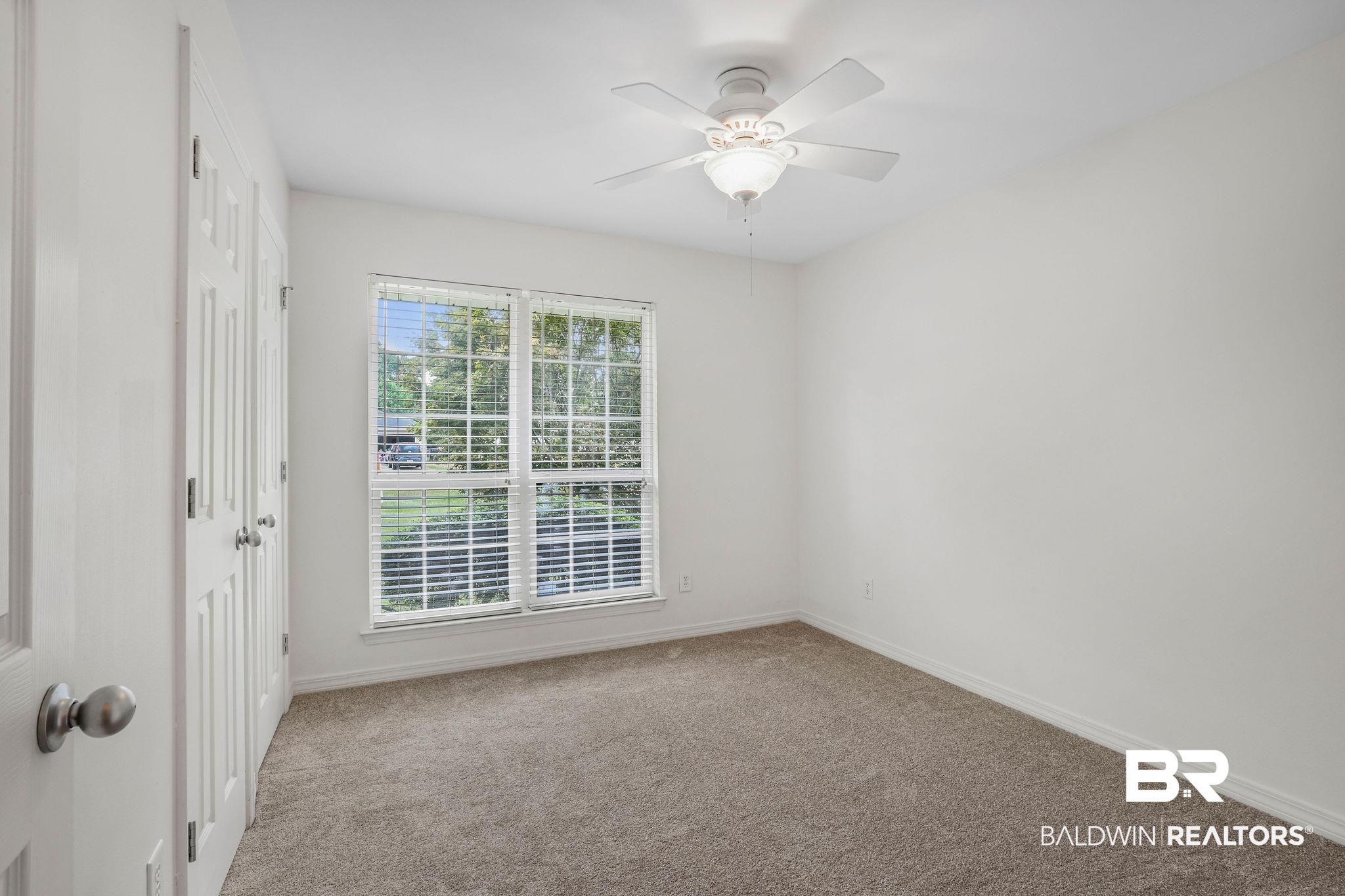 18620 Hammond Street Robertsdale, AL 36567 - Photo 12 of 23 Carpeted empty room featuring ceiling fan